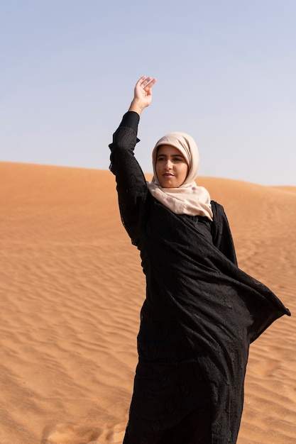 Premium Photo | Woman wearing hijab in the desert