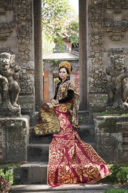 Premium Photo | Woman Wearing Traditional Black Balinese Kebaya With ...