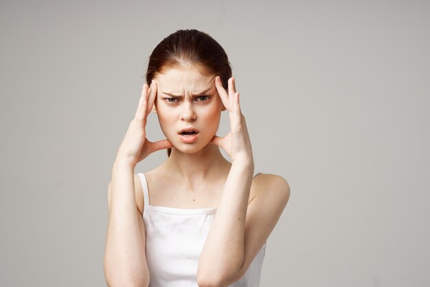 Premium Photo | Woman in white tshirt headache health problems stress ...