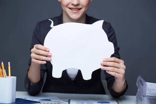 Woman with a white piggy bank Free Photo Woman with a white piggy bank Free Photo