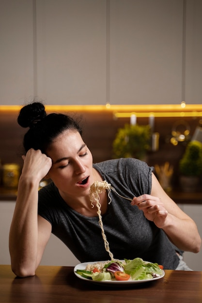 Free Photo | Woman with eating disorder trying to eat healthy