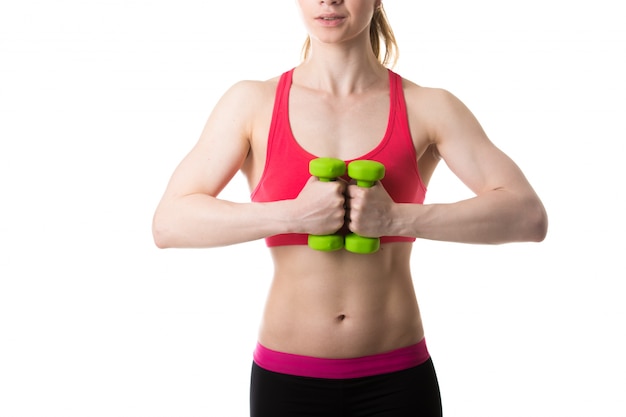 Woman with folded hands and weights Free Photo