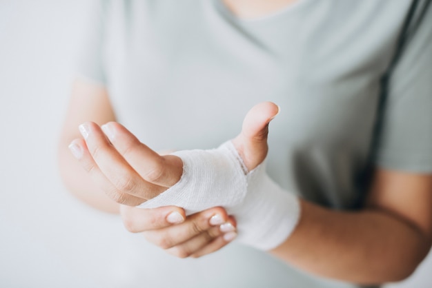 Woman with gauze bandage wrapped around her hand Free Photo