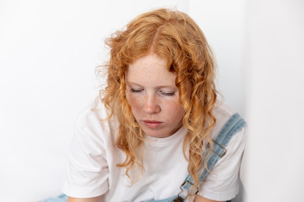 Woman With Ginger Hair Looking Down Photo Free Download