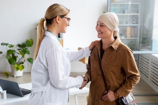 Woman with skin cancer talking with her doctor Free Photo