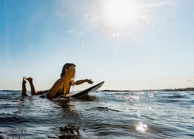 Free Photo | Woman with surfboard in water