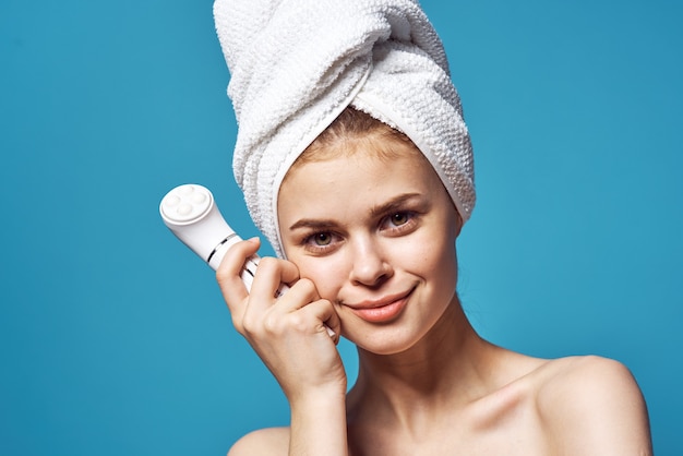 Premium Photo Woman With Towel On Head Naked Shoulders Massager