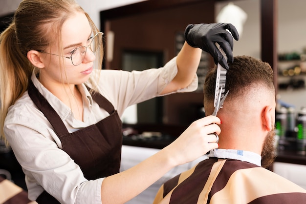 Woman working at the barber shop Photo | Free Download