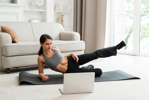 Free Photo | Woman working out alone at home