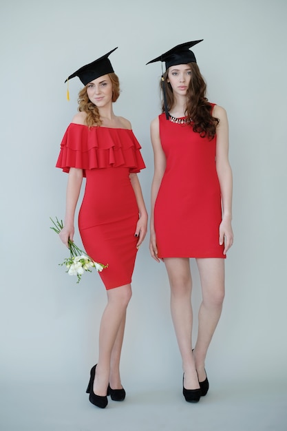 women in red dresses