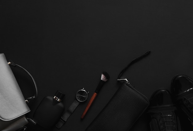 Premium Photo | Women's accessories on black background