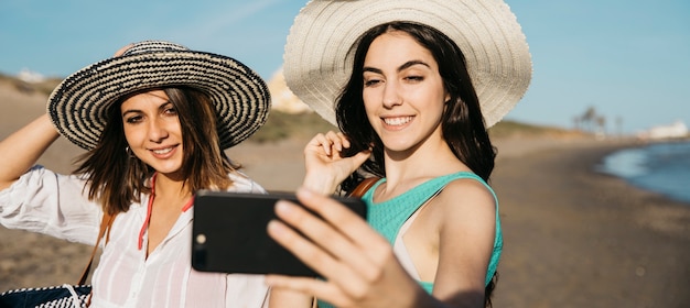 Free Photo Women Taking A Selfie At The Beach