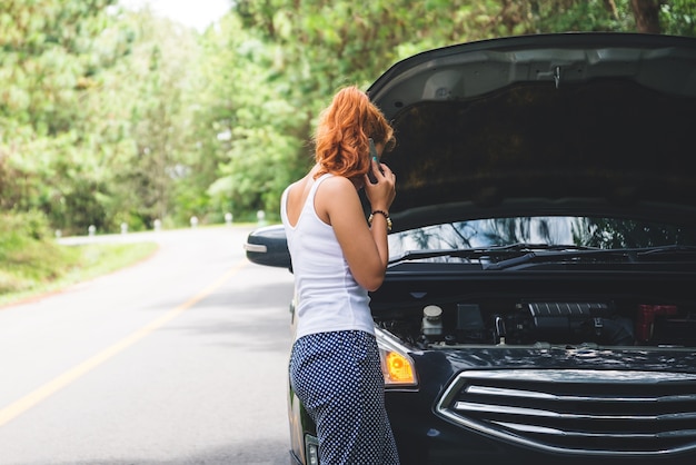 Women The car was broken on the highway. countryside. Women broken car Premium Photo