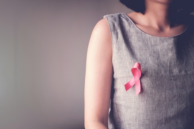 Women with pink ribbon, breast cancer awareness Premium Photo