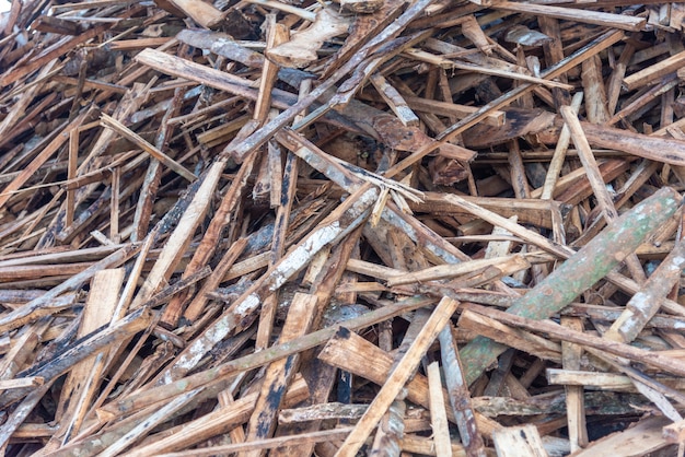 Premium Photo | Wood scrap pile for recycle of wood factory