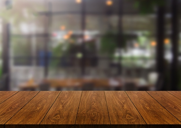 Premium Photo | Wood table in blur background of modern restaurant