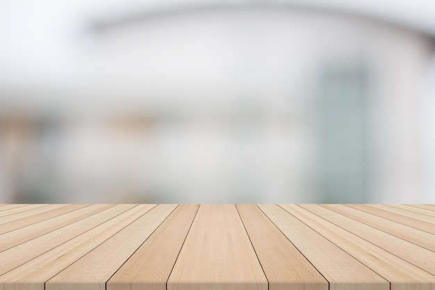 Wood table top on white blurred background from building,for montage