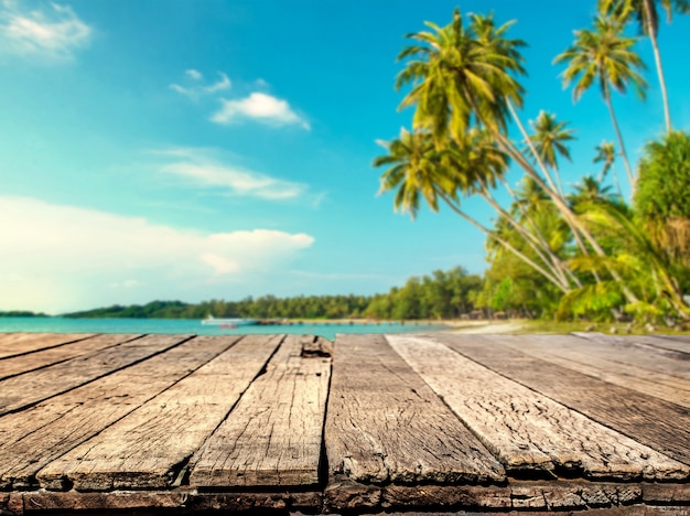 Premium Photo Wood Table With Blurred Sea And Coconut Tree Background