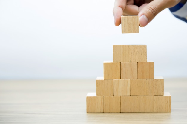 Premium Photo | Wooden blocks stacked intro pyramid shape