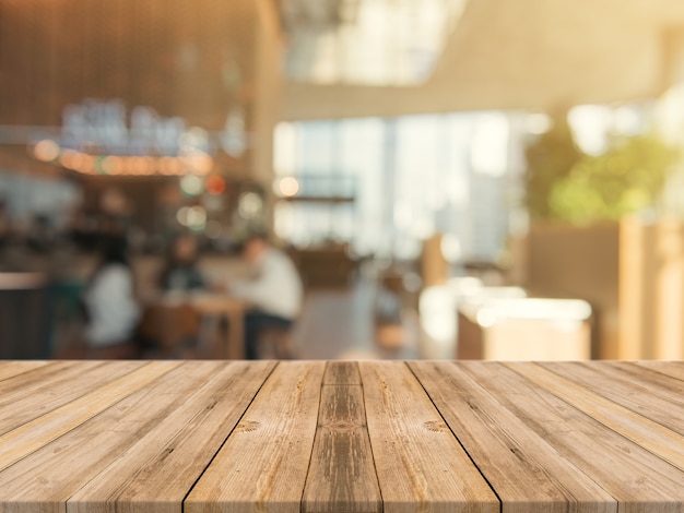 Wooden board empty table top on of blurred background 