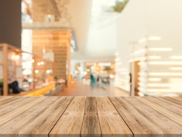 wooden board empty table top on of blurred background perspective brown wood table over blur in coffee shop background can be used mock up for montage products display or design key visual layout_1253 952