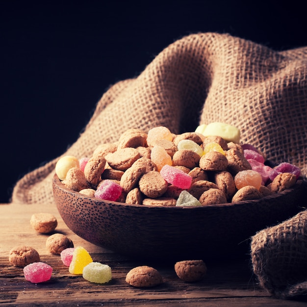 Premium Photo Wooden Bowl With Typical Dutch Sweets For Sinterklaas