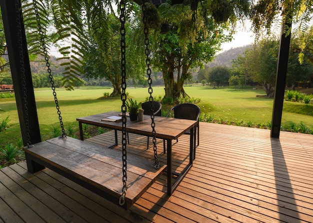 Wooden chair with table on patio Premium Photo