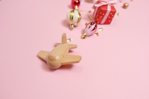 Wooden children's plane on a pink background Photo | Premium Download