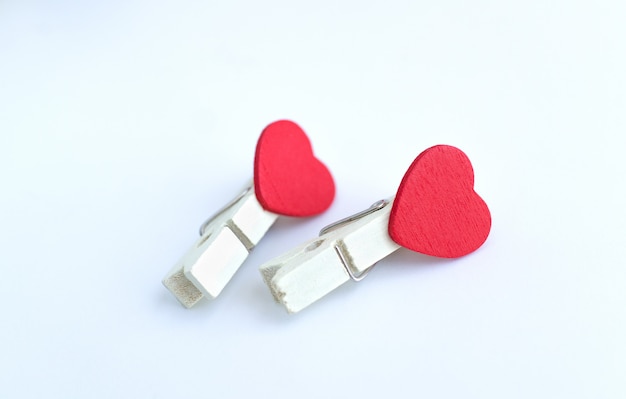 Premium Photo | Wooden clothes pin or cloth pegs with heart shape ...