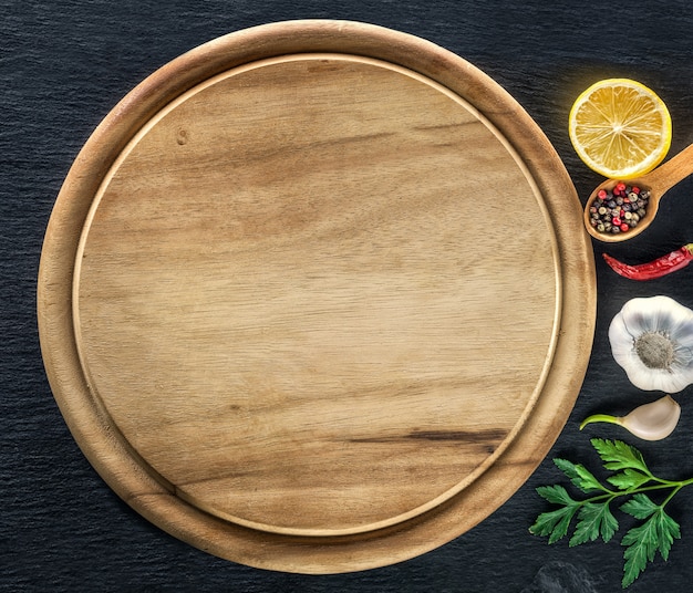 Premium Photo | Wooden Cutting Board And Spices