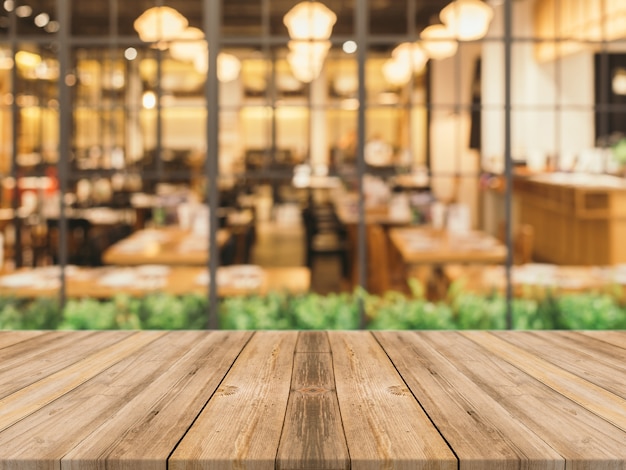 Wooden planks with blurred restaurant  background Photo 