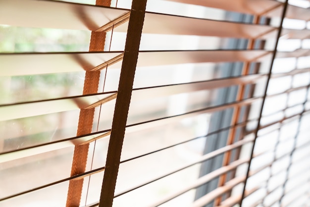 Wooden shutters on the window in the living room | Premium Photo