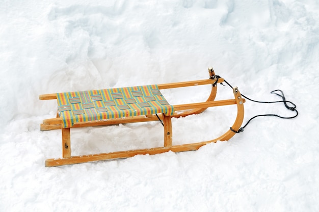 Premium Photo | Wooden sled on snow