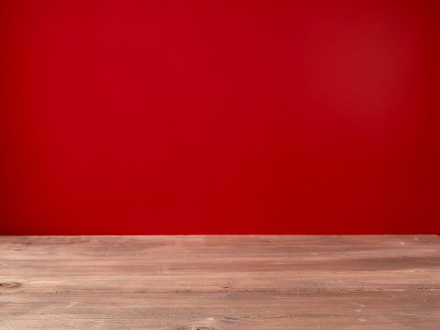 Premium Photo | Wooden table on red wall background