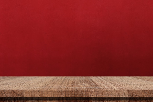 Premium Photo | Wooden table and red wall background