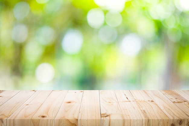 Premium Photo | Wooden table with blur background of nature forest.