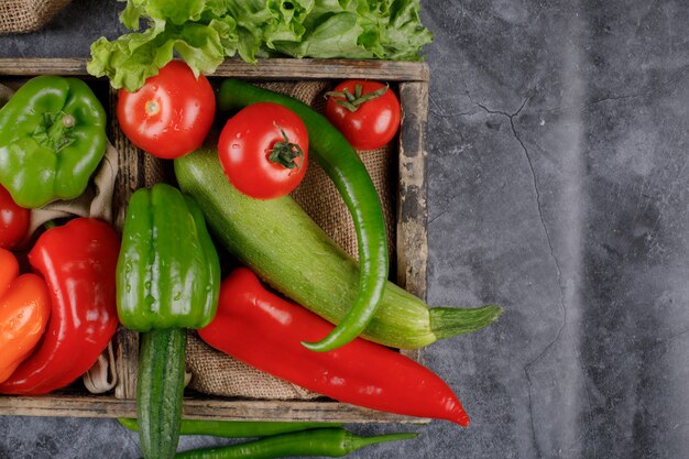 Free Photo | A wooden tray of red and green vegetables.