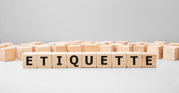 Premium Photo | Word Etiquette Made With Wood Building Blocks