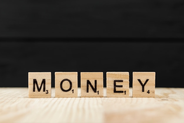 the-word-money-spelt-with-wooden-letters-photo-free-download