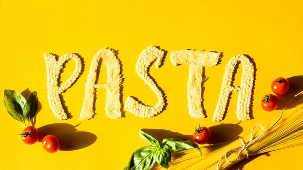 premium-photo-a-word-pasta-is-laid-out-of-small-pasta-on-a-yellow-background