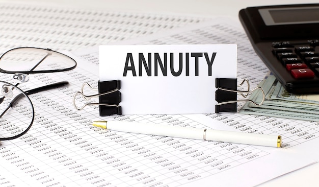 Premium Photo | Word writing text annuity on white sticker on chart surface