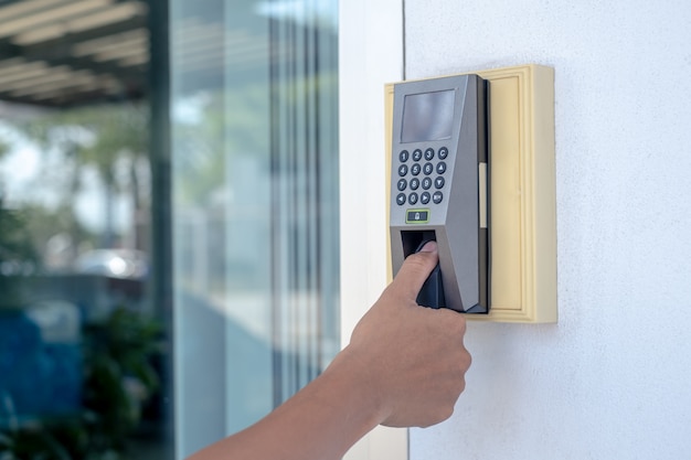 Premium Photo | Worker are scanning his fingers to open the door or to ...