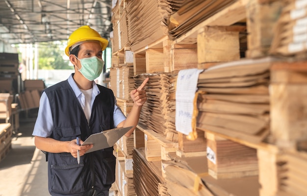 Premium Photo | Worker checking raw material inventory in factory