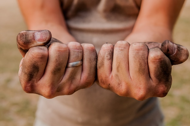 Worker man with dirty hands. Photo | Premium Download