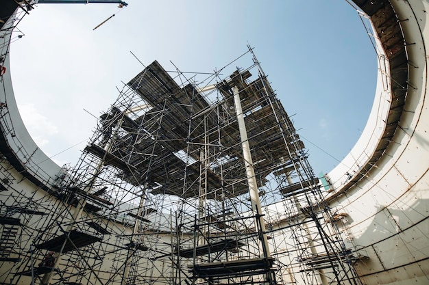 Premium Photo | Worker in progress tank oil inspection scaffolding in ...