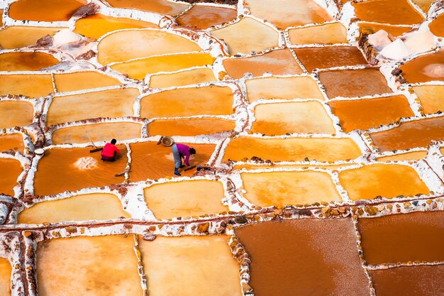 Premium Photo Workers At Salinas De Maras Near Cusco Salt Extraction