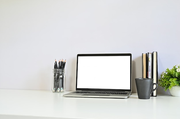 Premium Photo | Workspace laptop, coffee, pencil and notebook on office ...