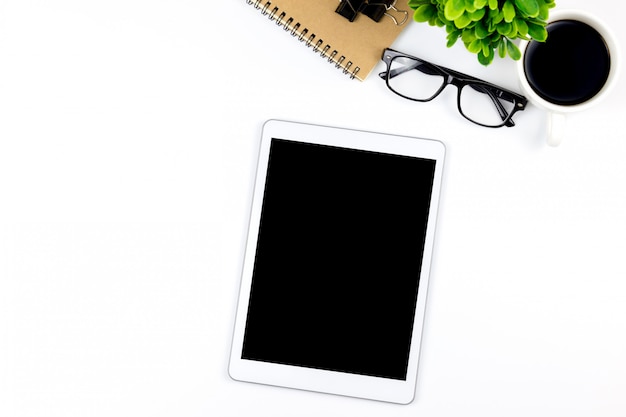 Workspace in office with tablet and with empty blank screens are on top Premium Photo