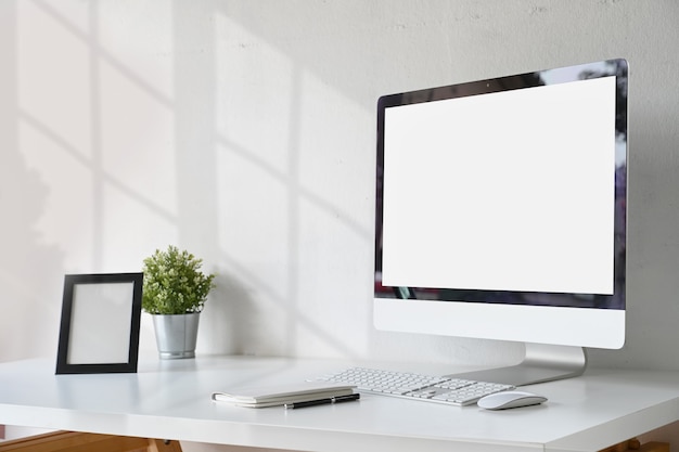 Workspace with blank screen desktop computer Premium Photo