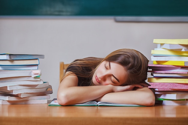 Premium Photo World Book Day Young Woman Fell Asleep While Reading Books At The Table